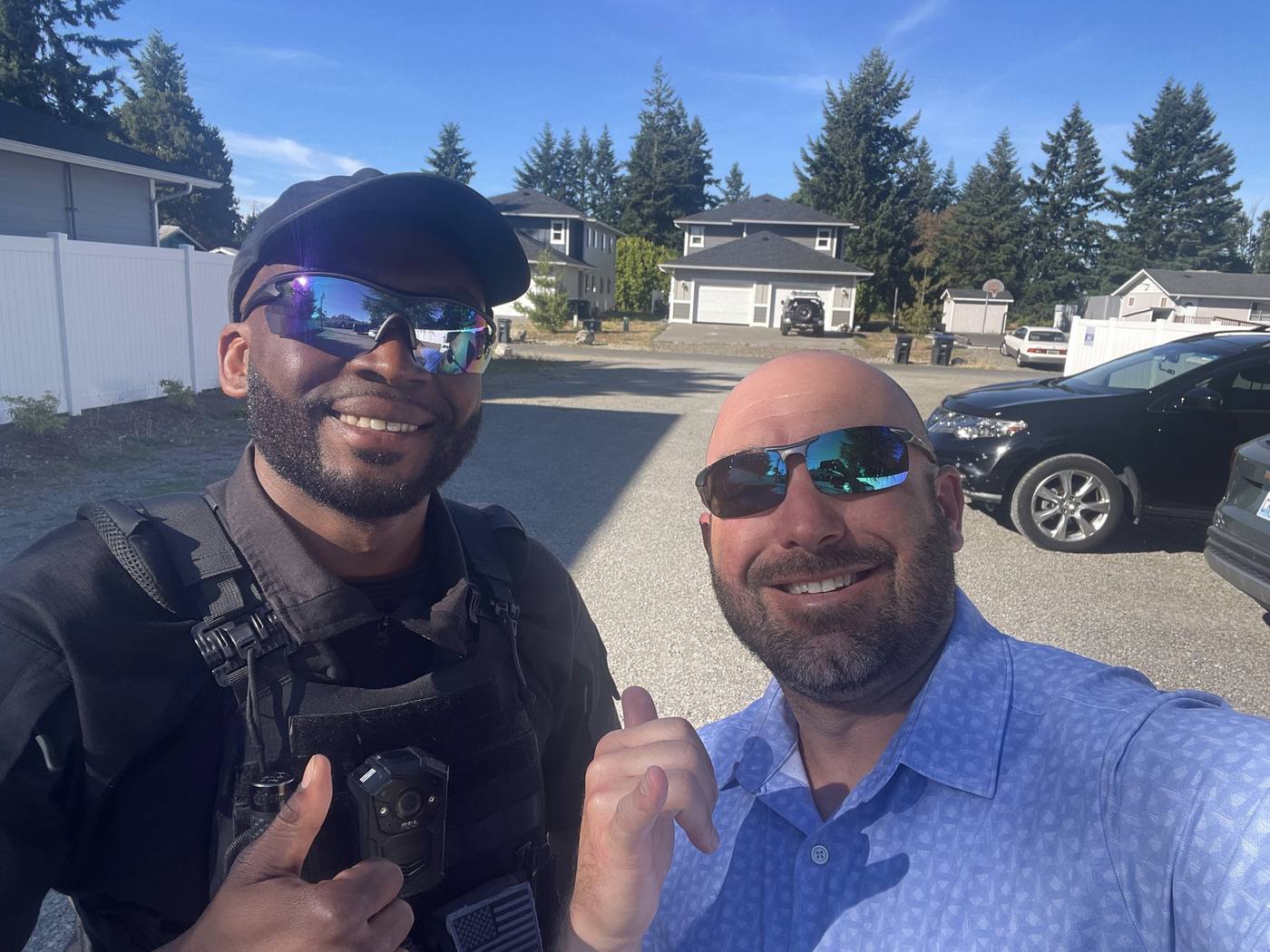 Two smiling YARD Security Services team members on site — approachable professional security